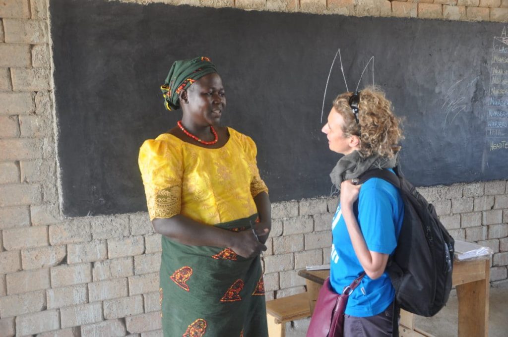 Emilia Sorrentino speaking to a teacher in East Cameroon